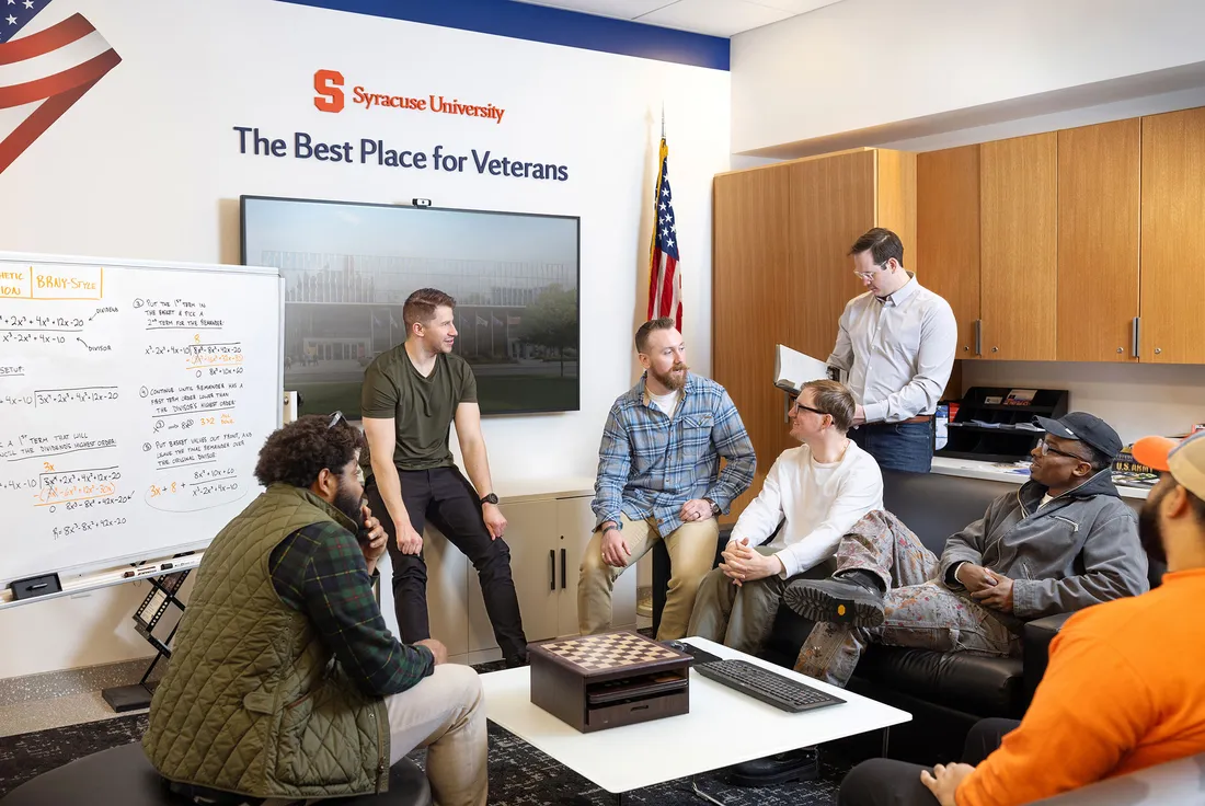 Portrait of Raphael Grollmus with a group of other student veterans.